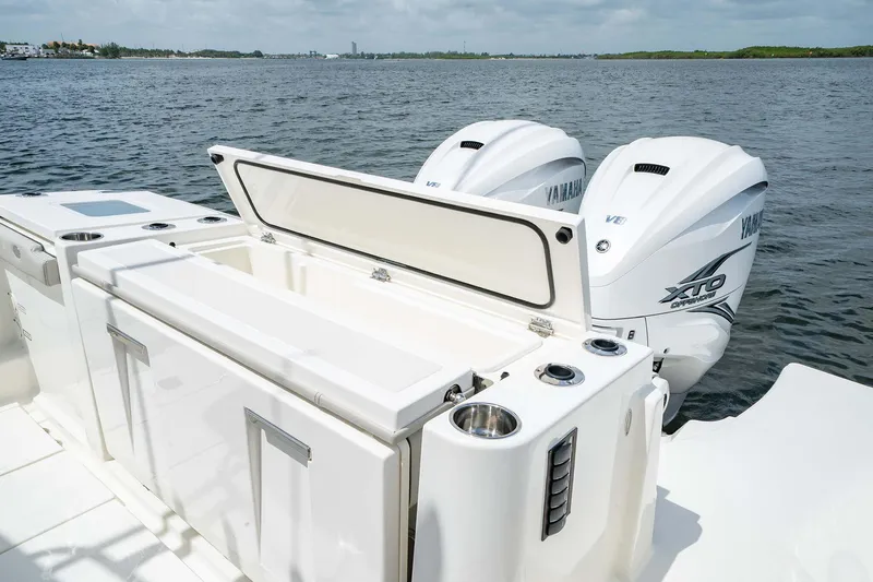Slide: The Image of 2025 Pursuit S 358 boat with dual Yamaha outboard engines on open water. - 22