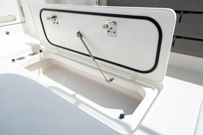 Slide: The Image of Open storage compartment on 2025 Pursuit S 358 boat. - 27