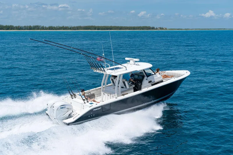 Slide: The Image of 2025 Pursuit S 358 boat cruising on open water. - 3