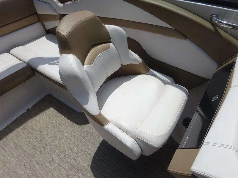 Slide: The Image of 2015 Four Winns Sundowner 235 boat interior with white and tan seating. - 11