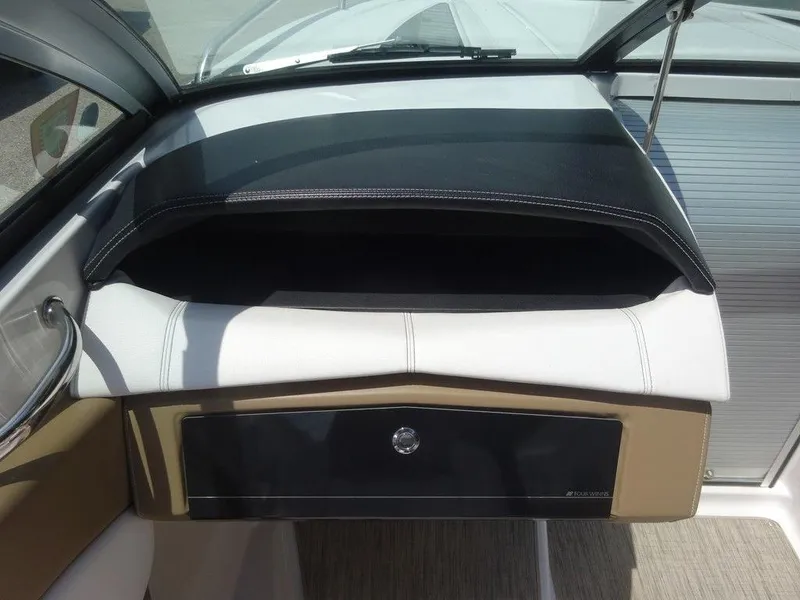 Slide: The Image of 2015 Four Winns Sundowner 235 boat dashboard and glove compartment. - 14