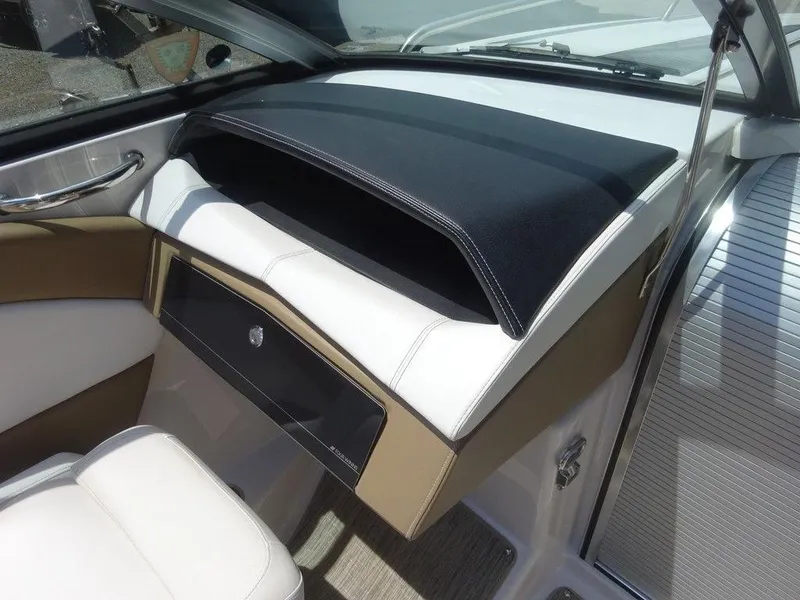 Slide: The Image of 2015 Four Winns Sundowner 235 boat interior dashboard and seating. - 15