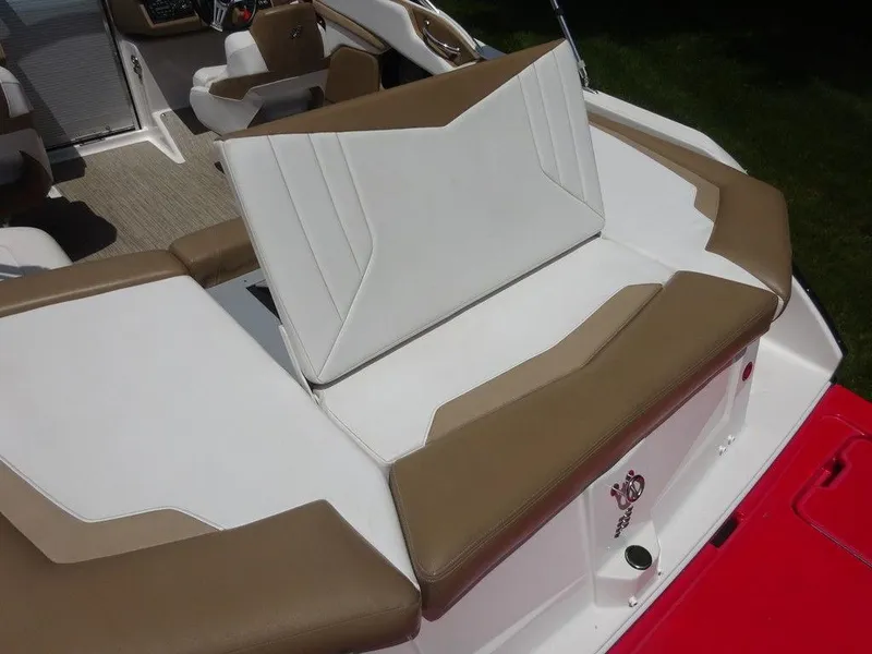 Slide: The Image of 2015 Four Winns Sundowner 235 boat interior with tan and white seating. - 18