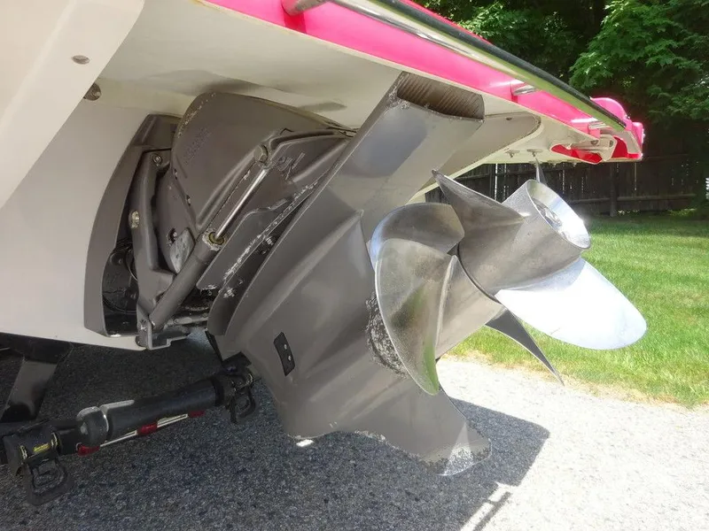 Slide: The Image of 2015 Four Winns Sundowner 235 boat propeller and stern drive close-up. - 21