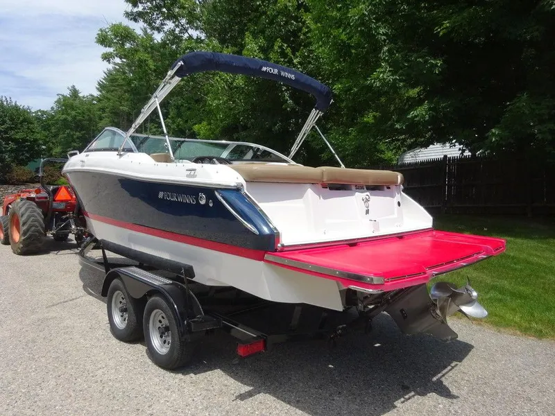 Slide: The Image of 2015 Four Winns Sundowner 235 boat on trailer, rear view. - 4