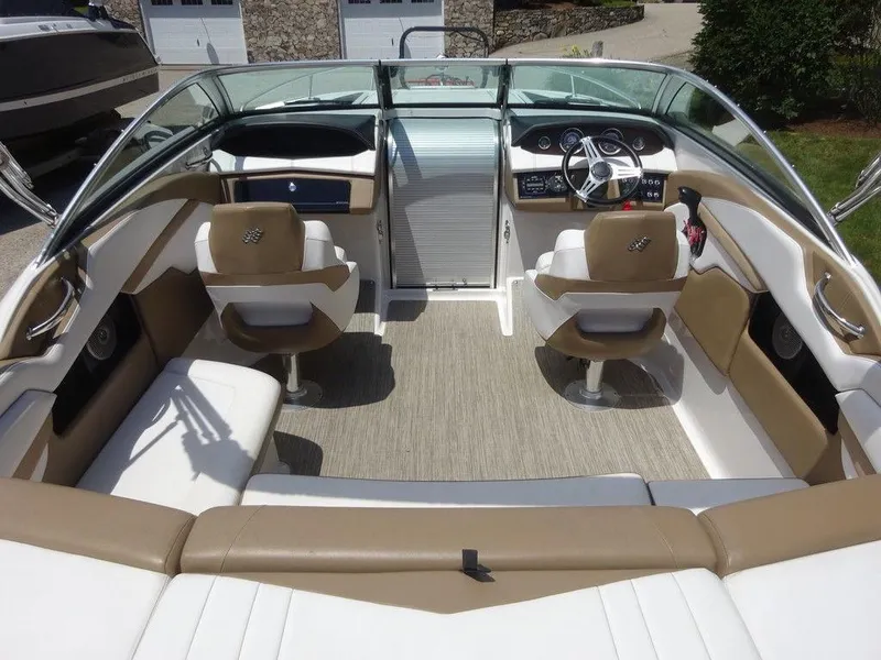Slide: The Image of 2015 Four Winns Sundowner 235 boat interior with beige and white seating. - 6