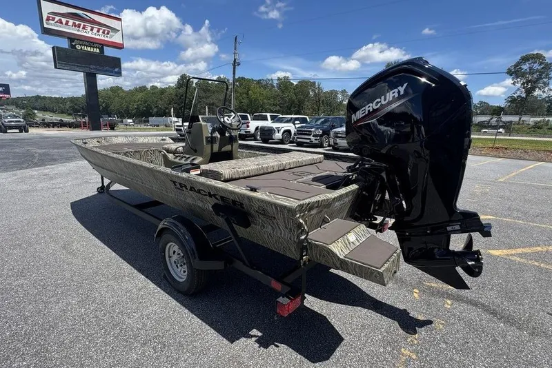 Slide: The Image of 2024 Tracker GRIZZLY® 1860 CC boat with Mercury engine at dealership. - 4