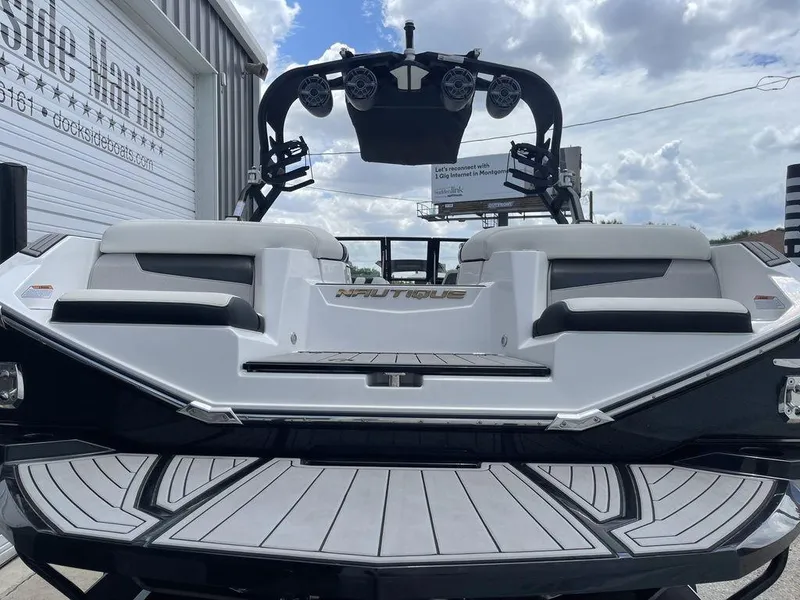 Slide: The Image of 2021 Nautique Super Air Nautique G23 boat rear view at Dockside Marine. - 2