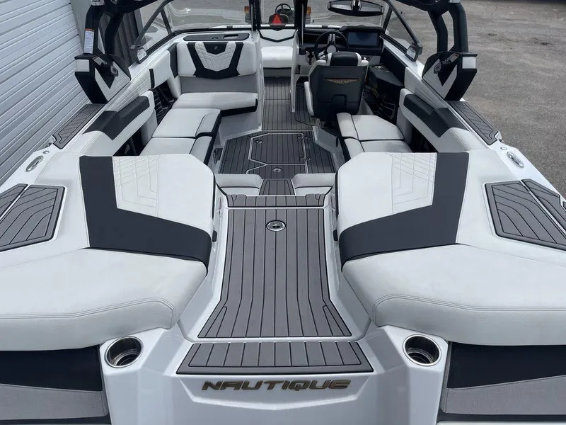 Slide: The Image of 2021 Nautique Super Air Nautique G23 interior with luxurious seating and modern design. - 4