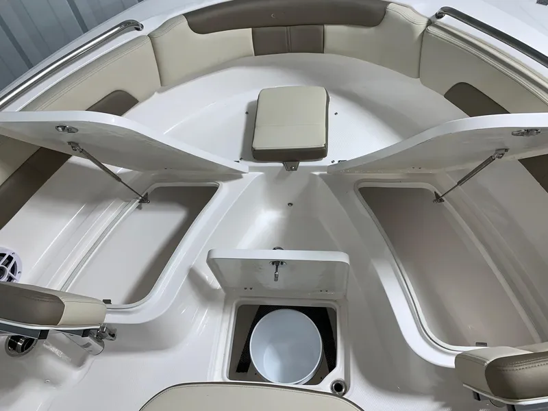 Slide: The Image of 2024 Robalo R222 Explorer boat interior with open storage compartments. - 14