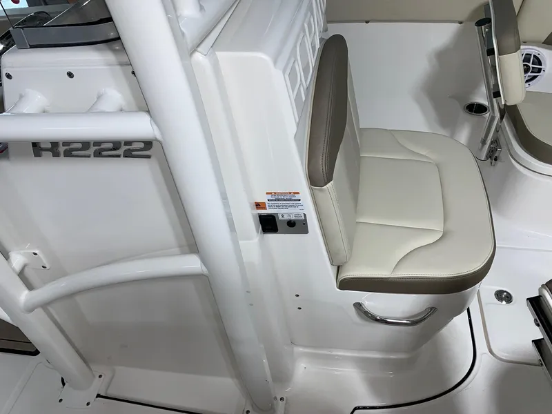 Slide: The Image of 2024 Robalo R222 Explorer boat interior seating and console. - 15