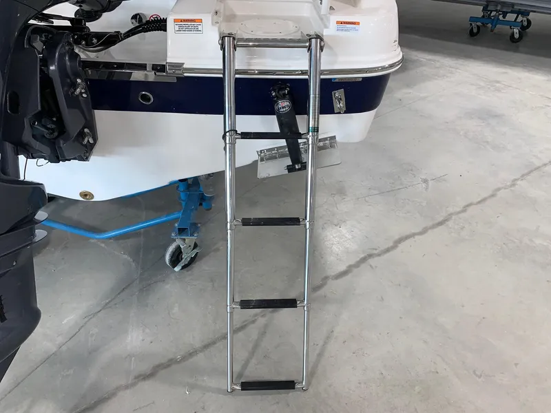Slide: The Image of 2024 Robalo R222 Explorer boat with extended swim ladder. - 4