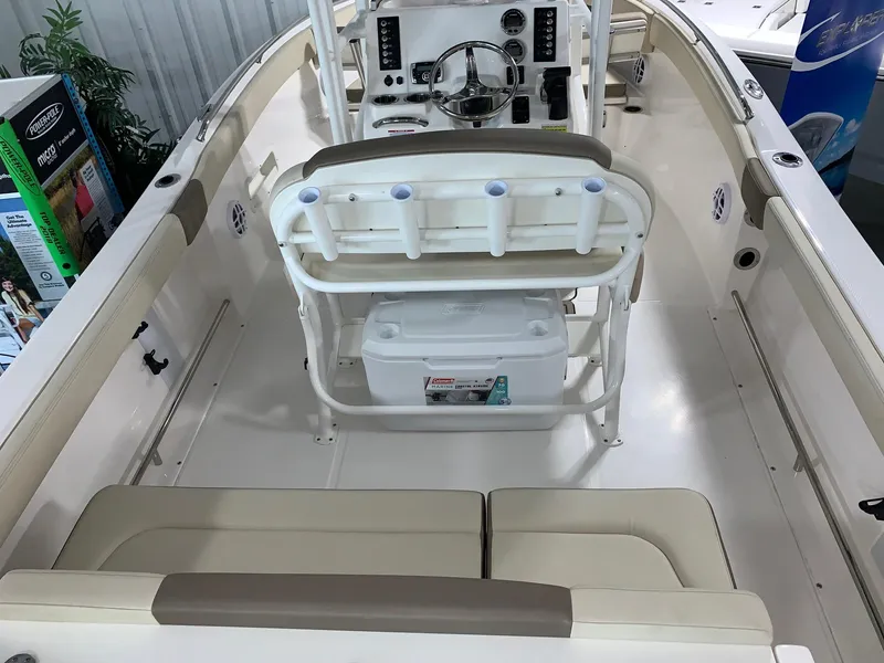 Slide: The Image of 2024 Robalo R222 Explorer boat interior with seating and console. - 5