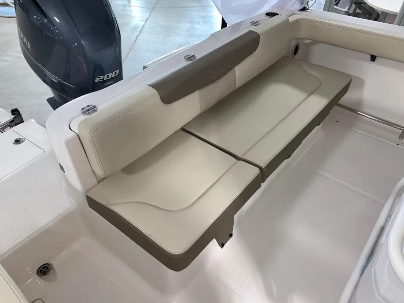 Slide: The Image of 2024 Robalo R222 Explorer boat with cushioned seating and Yamaha 200 engine. - 8