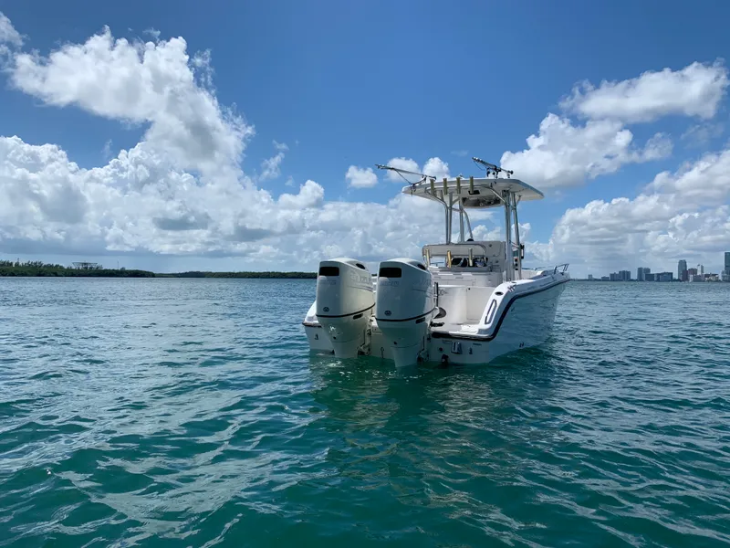 Slide: The Image of Century 2600CC 2006 boat on open water under a clear blue sky. - 7