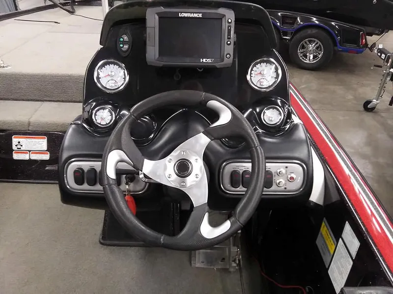 Slide: The Image of Dashboard of a 2015 Nitro Z-8 DC boat with steering wheel and instruments. - 23