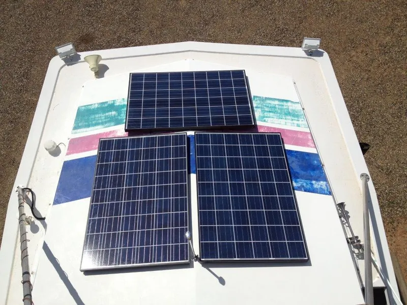 Slide: The Image of Solar panels on a 1996 Stardust Cruisers boat, last week of September 2022. - 9