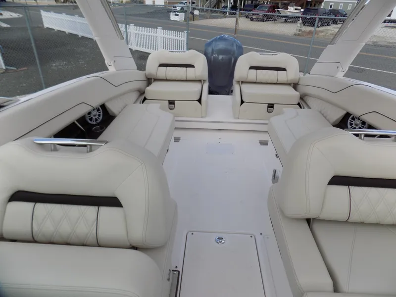 Slide: The Image of 2021 Regal LX6 boat interior with luxurious beige seating and spacious layout. - 11