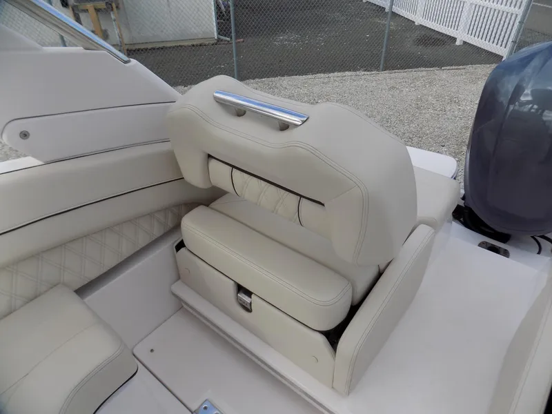 Slide: The Image of 2021 Regal LX6 boat interior with beige seating and modern design. - 13