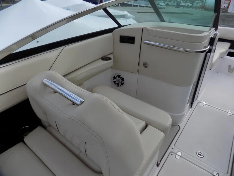Slide: The Image of 2021 Regal LX6 boat interior with beige seating and modern design. - 9