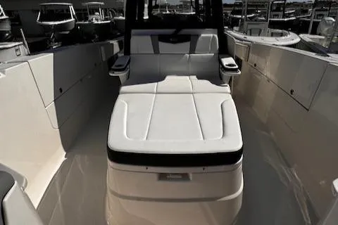 Slide: The Image of 2024 Robalo R360 boat interior with sleek seating and modern design. - 14
