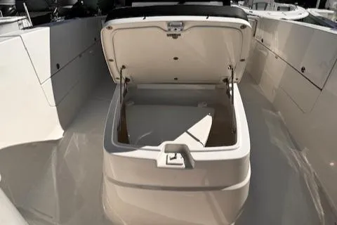 Slide: The Image of Open storage compartment on 2024 Robalo R360 boat deck. - 15