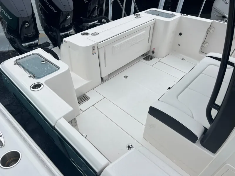 Slide: The Image of 2024 Robalo R360 boat deck with seating and storage compartments. - 16