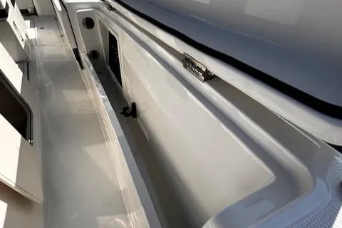 Slide: The Image of 2024 Robalo R360 boat storage compartment, open and spacious design. - 20