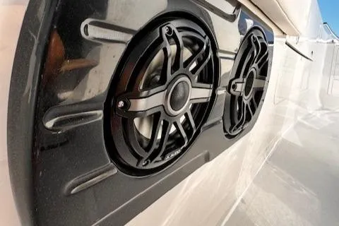 Slide: The Image of 2024 Robalo R360 boat speakers, sleek black design, close-up view. - 21