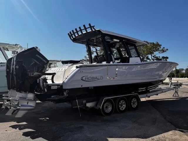 Slide: The Image of 2024 Robalo R360 boat on trailer, side view, outdoors. - 4