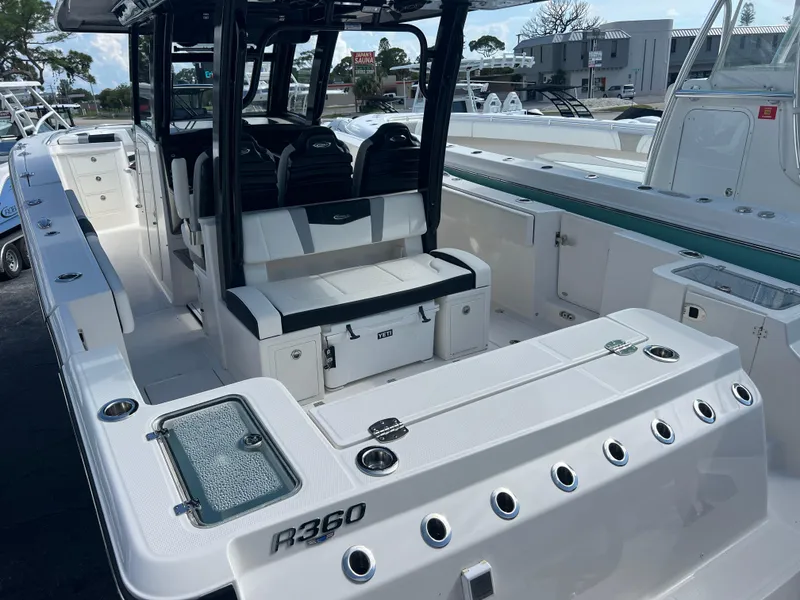 Slide: The Image of 2024 Robalo R360 boat interior with seating and storage compartments. - 8