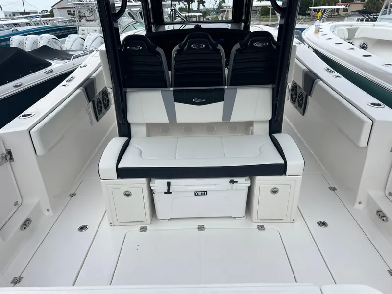 Slide: The Image of 2024 Robalo R360 boat interior with seating and storage compartments. - 9