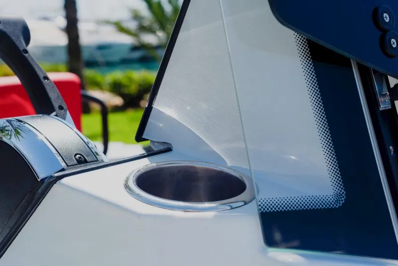 Slide: The Image of Close-up of the 2023 Saxdor 200 SPORT boat's cup holder and console. - 13