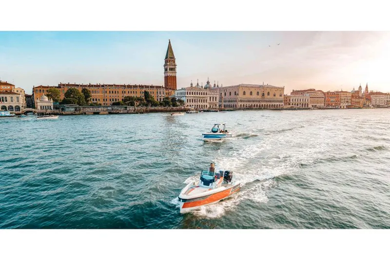 Slide: The Image of Saxdor 200 SPORT 2023 cruising in scenic Venice waters at sunset. - 14