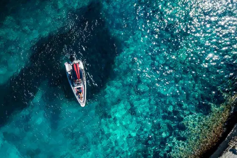 Slide: The Image of Aerial view of 2023 Saxdor 200 SPORT boat on clear turquoise water. - 17