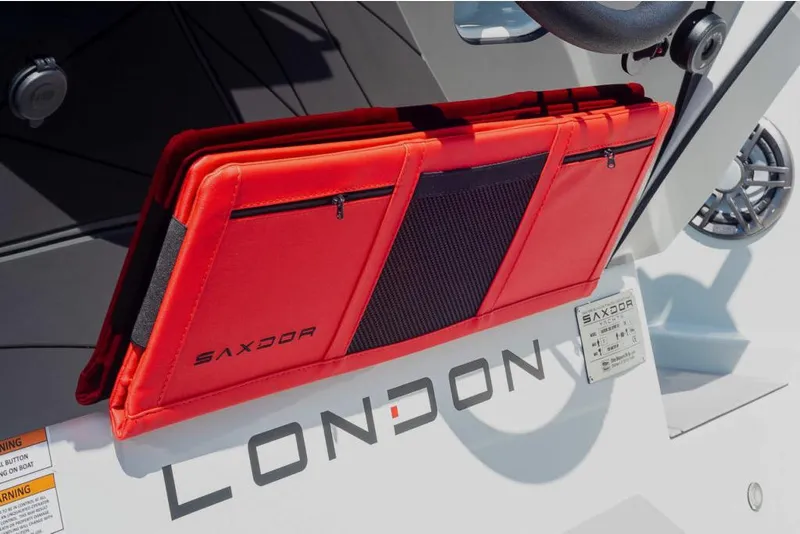 Slide: The Image of Red storage compartment on 2023 Saxdor 200 SPORT boat, labeled London. - 28