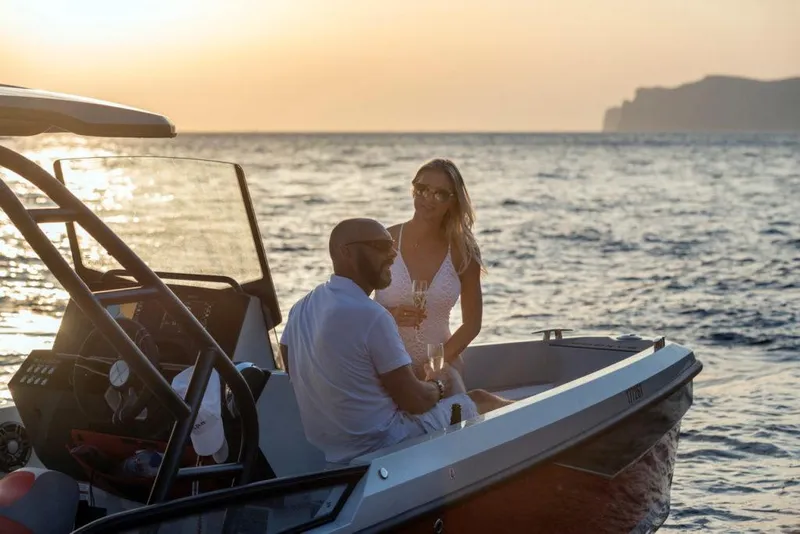 Slide: The Image of Couple enjoying sunset on 2023 Saxdor 200 SPORT boat. - 6