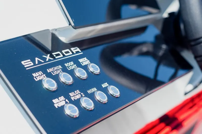 Slide: The Image of Control panel of 2023 Saxdor 200 Pro Sport boat with labeled buttons. - 8