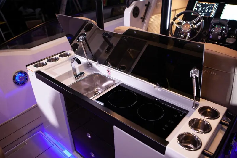 Slide: The Image of 2023 Saxdor 320 GTO boat interior with modern kitchen and control panel. - 10