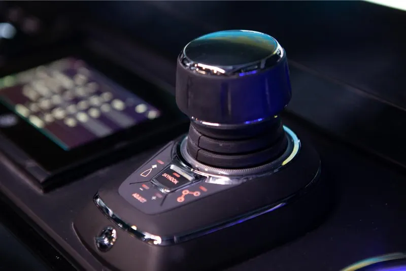 Slide: The Image of Close-up of the 2023 Saxdor 320 GTO control joystick. - 18