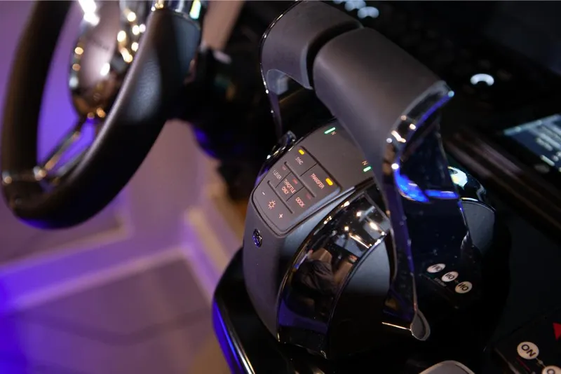 Slide: The Image of Close-up of the 2023 Saxdor 320 GTO throttle and steering wheel. - 21