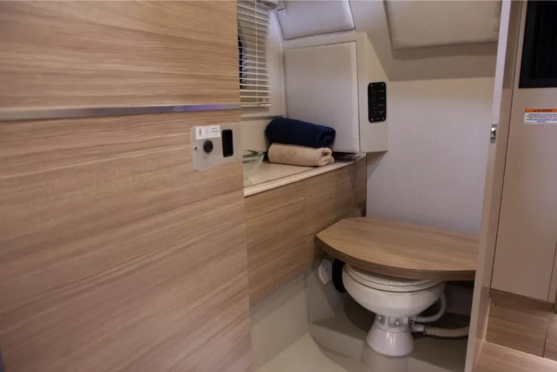 Slide: The Image of 2023 Saxdor 320 GTO boat bathroom with wooden finishes and modern amenities. - 42