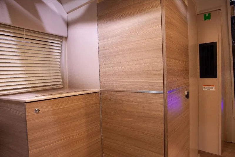 Slide: The Image of Interior of 2023 Saxdor 320 GTO with modern wooden cabinetry and blinds. - 44