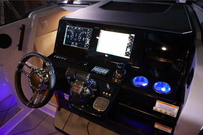 Slide: The Image of Cockpit of 2023 Saxdor 320 GTO with illuminated controls and modern navigation display. - 6