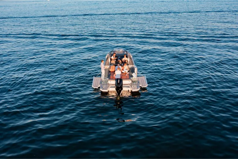 Slide: The Image of 2023 Saxdor 320 GTR boat cruising on open water. - 11