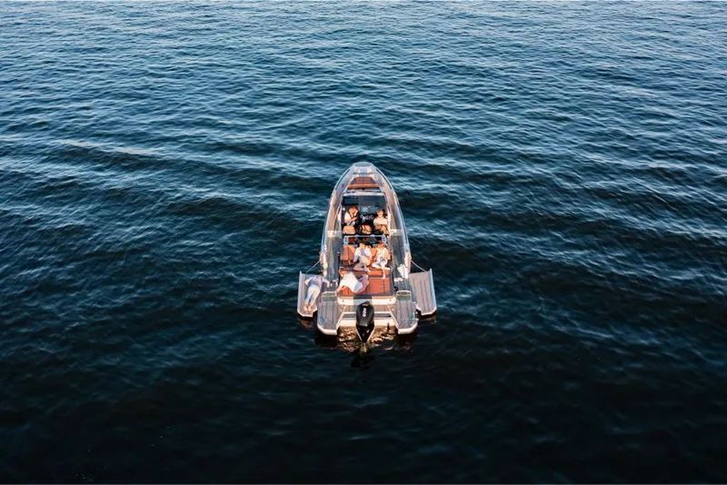 Slide: The Image of 2023 Saxdor 320 GTR boat cruising on open water. - 12