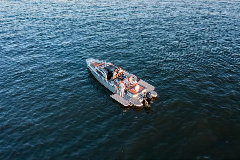 Slide: The Image of 2023 Saxdor 320 GTR boat cruising on open water. - 13