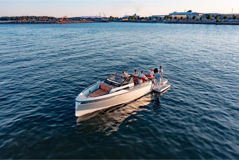 Slide: The Image of 2023 Saxdor 320 GTR boat cruising with passengers on a calm sea. - 16