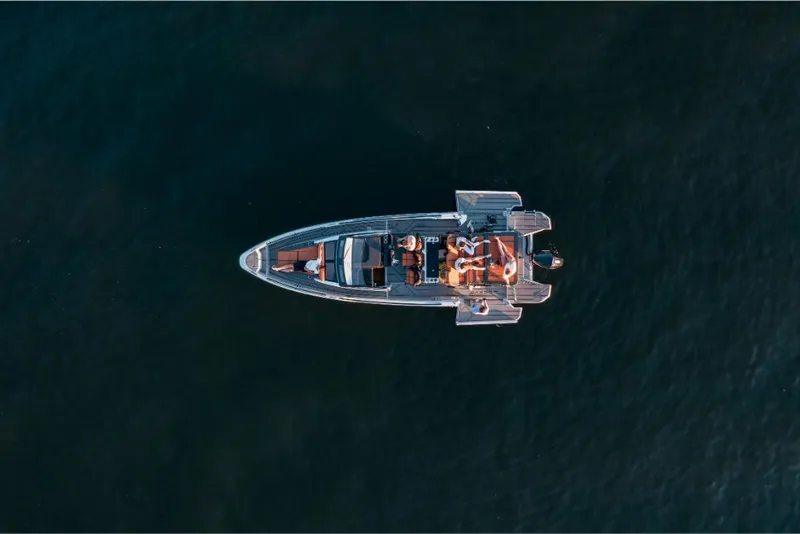 Slide: The Image of Aerial view of 2023 Saxdor 320 GTR boat on water. - 17