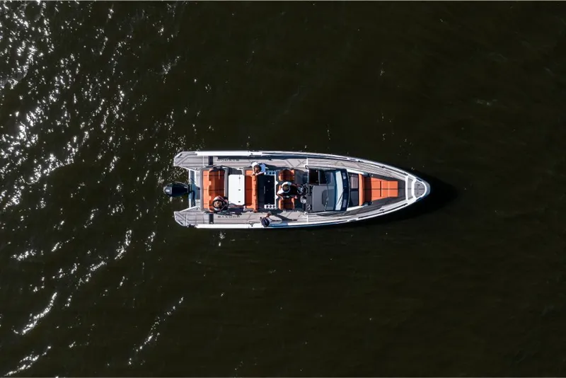 Slide: The Image of Aerial view of 2023 Saxdor 320 GTR boat on water. - 18